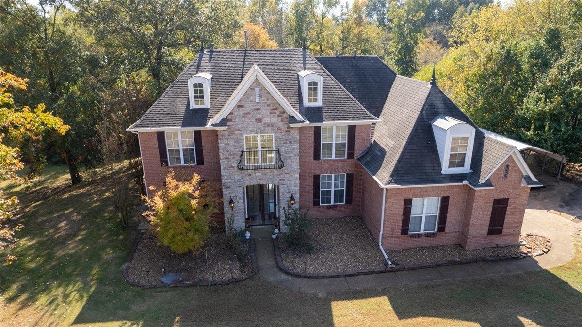 10941 Lubov Road Arlington, TN 38002 - Photo 1 of 39 a front view of a house with garden