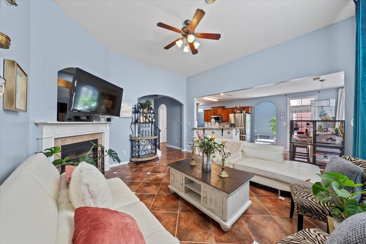 10941 Lubov Road Arlington, TN 38002 - Photo 15 of 39 a living room with fireplace furniture and a flat screen tv