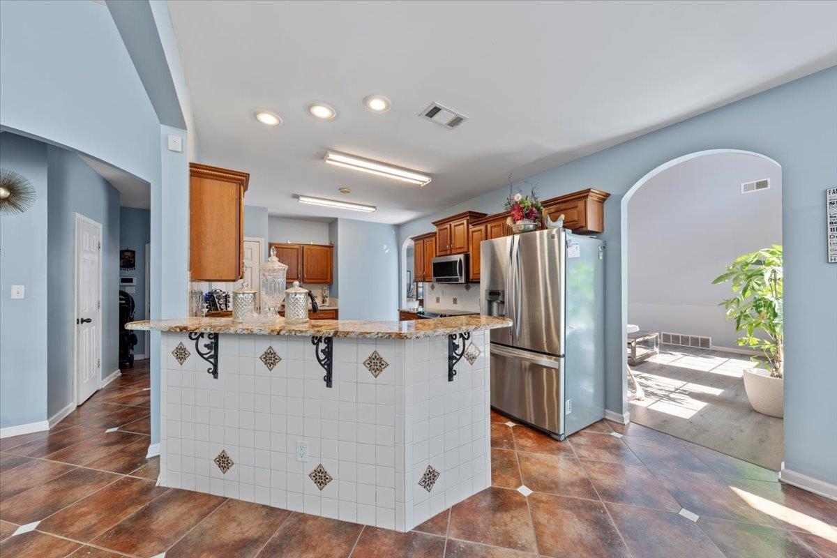 10941 Lubov Road Arlington, TN 38002 - Photo 16 of 39 a view of kitchen with stainless steel appliances granite countertop a refrigerator and a sink