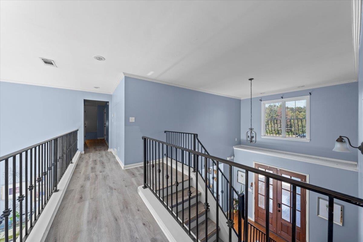 10941 Lubov Road Arlington, TN 38002 - Photo 19 of 39 a view of hallway with wooden floor and stairs