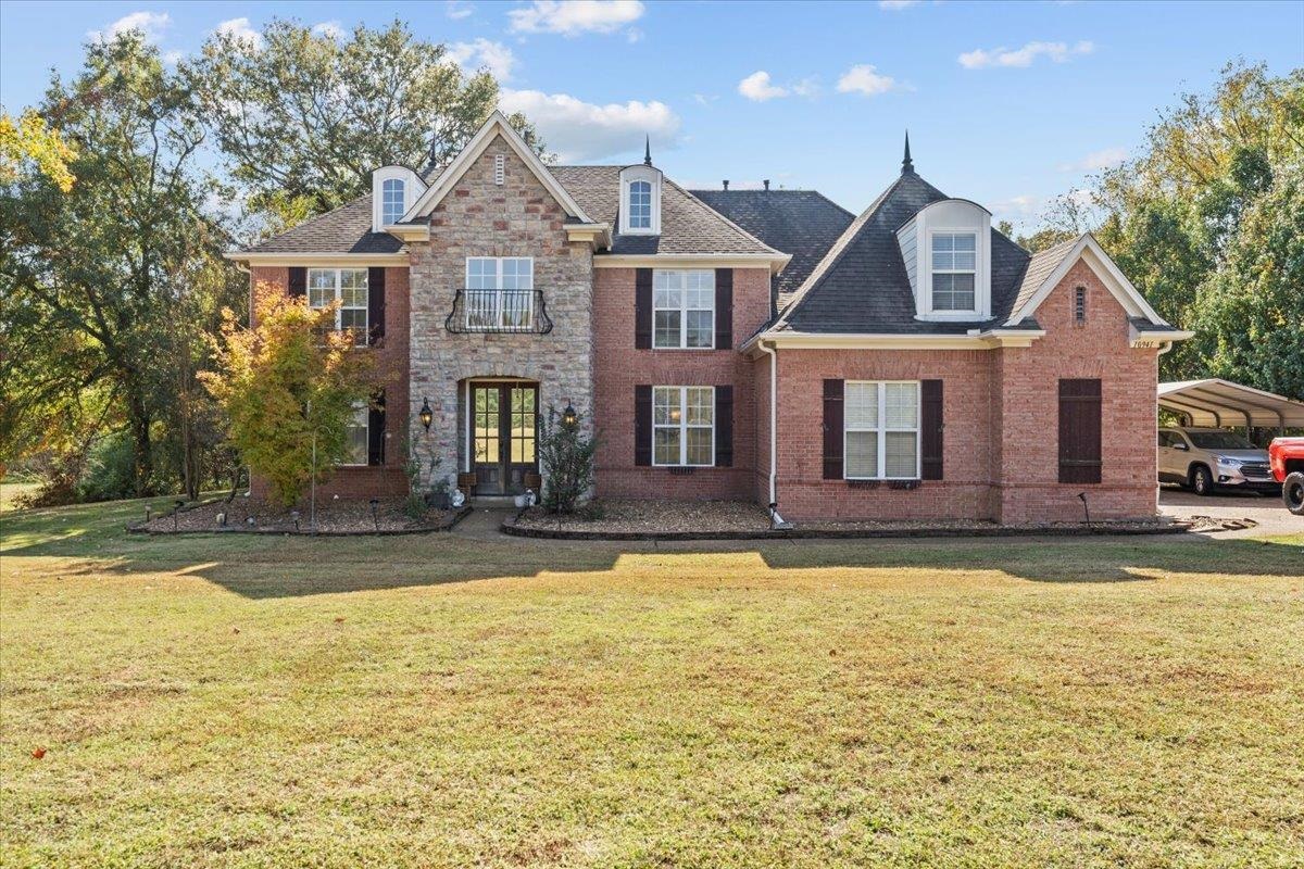 10941 Lubov Road Arlington, TN 38002 - Photo 2 of 39 a front view of a house with swimming pool