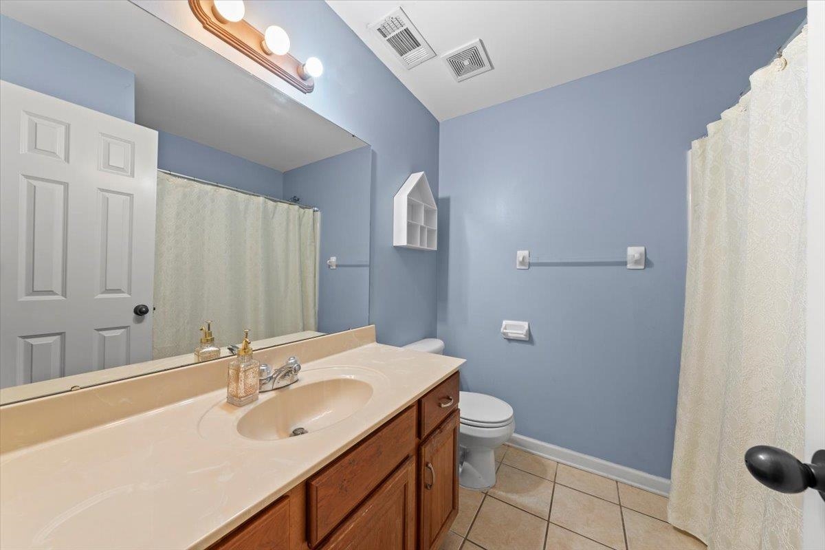10941 Lubov Road Arlington, TN 38002 - Photo 23 of 39 a bathroom with a sink and mirror with toilet