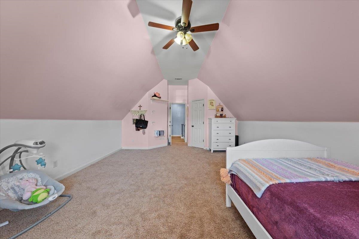 10941 Lubov Road Arlington, TN 38002 - Photo 25 of 39 a bedroom with a bed and a chandelier