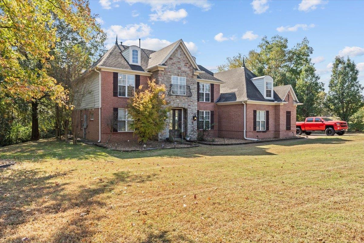10941 Lubov Road Arlington, TN 38002 - Photo 3 of 39 a front view of a house with a yard
