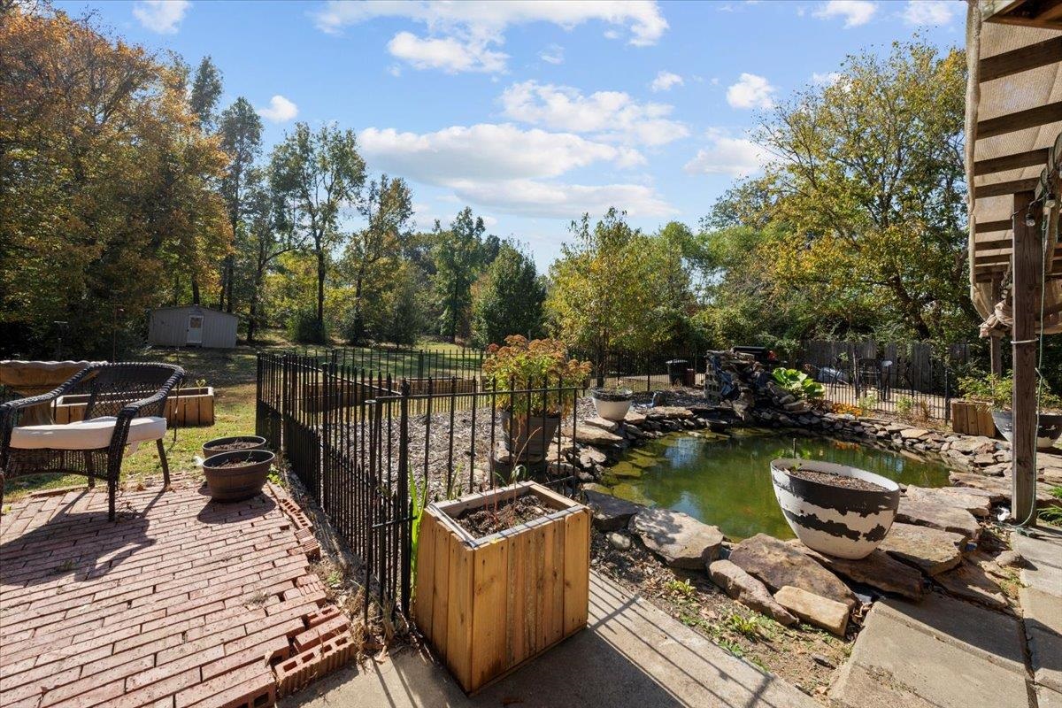 10941 Lubov Road Arlington, TN 38002 - Photo 33 of 39 a view of a roof deck with couches and wooden floor
