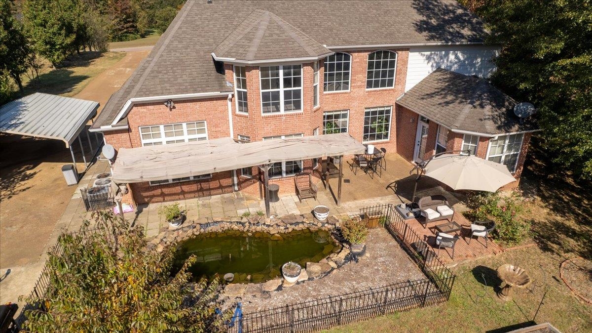 10941 Lubov Road Arlington, TN 38002 - Photo 34 of 39 a view of a house with a yard and sitting area