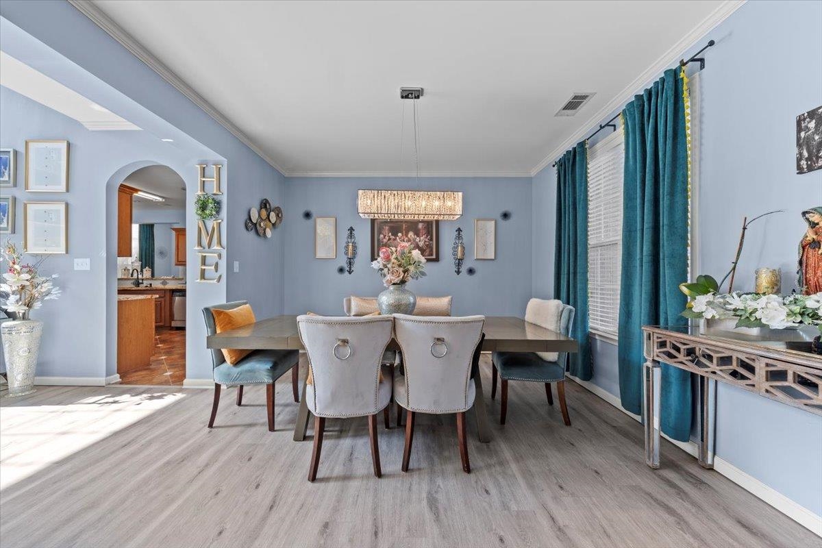 10941 Lubov Road Arlington, TN 38002 - Photo 5 of 39 a view of a dining room with furniture window and wooden floor