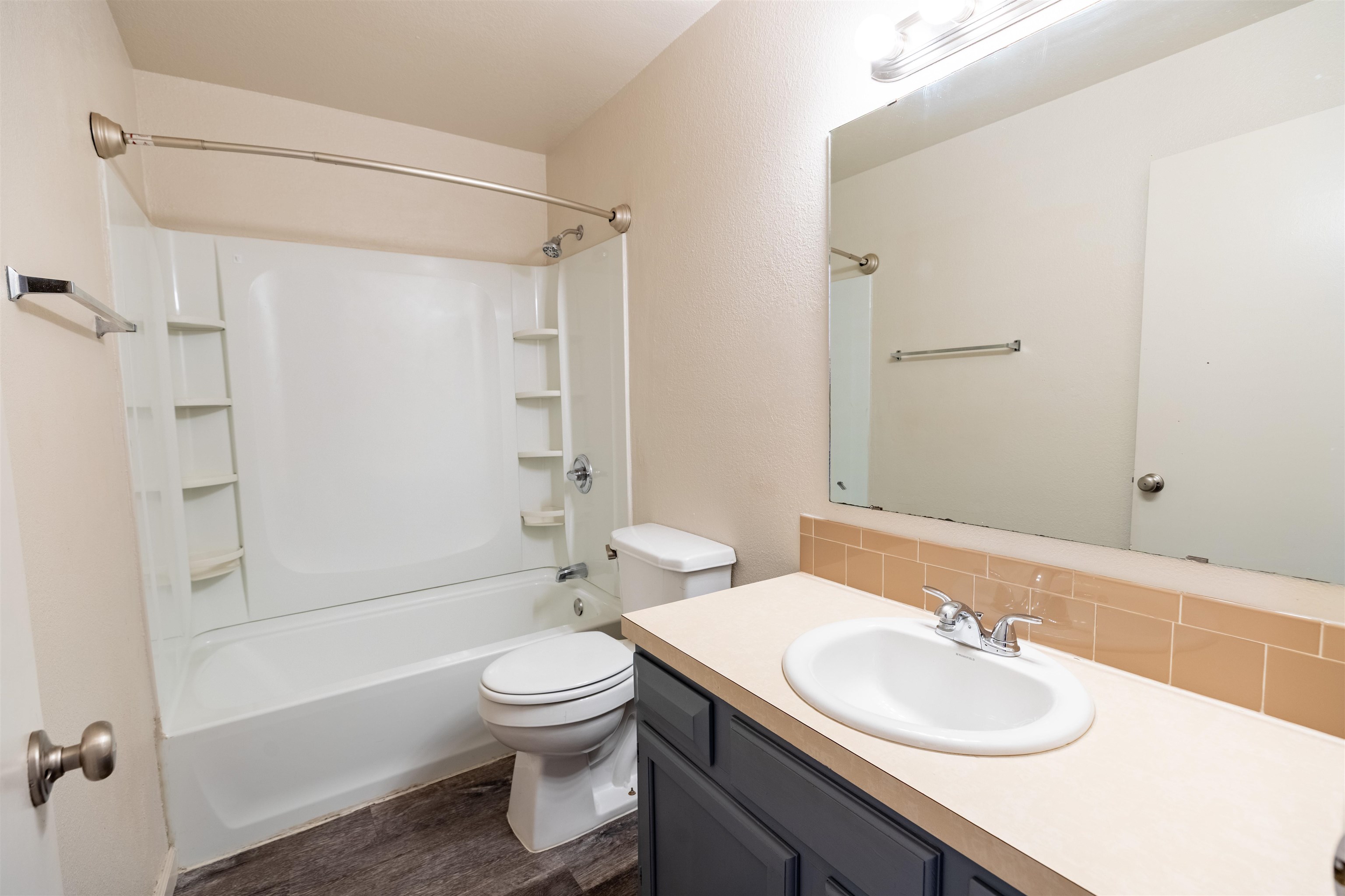 239 South Elm Street, Unit A Fruita, CO 81521 - Photo 14 of 22 a bathroom with a sink toilet tub vanity and shower