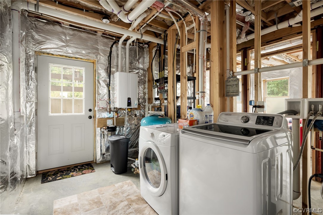 1797 Flattop Mountain Road Free Union, VA 22940 - Photo 38 of 43 Laundry area with tankless water heater and washer and dryer