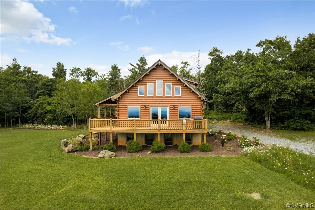 View of front of home with wooden deck