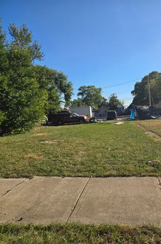 a view of a pool with a yard
