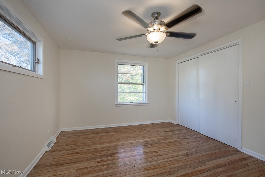 3136 Becket Road Cleveland, OH 44120 - Photo 24 of 39 Unfurnished bedroom featuring a closet, ceiling fan, and hardwood / wood-style floors