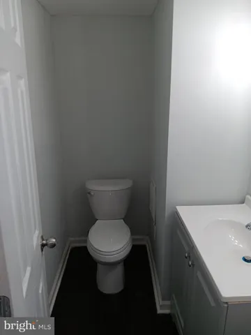 a bathroom with a toilet and a sink
