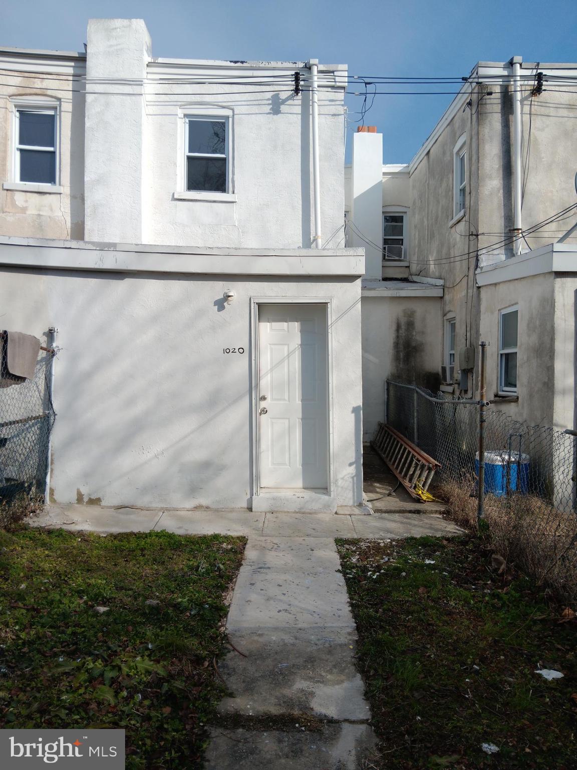 1020 Potter Street Chester, PA 19013 - Photo 16 of 16 a front view of a house with garden