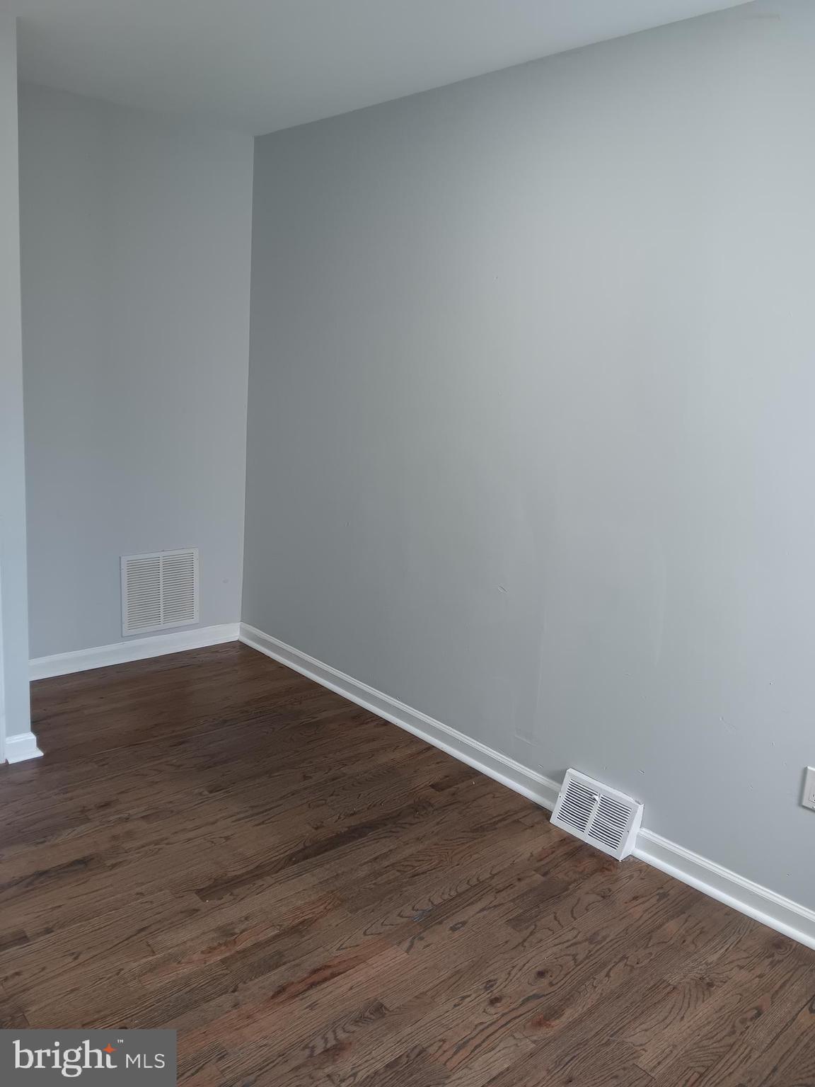 1020 Potter Street Chester, PA 19013 - Photo 5 of 16 a view of an empty room with wooden floor