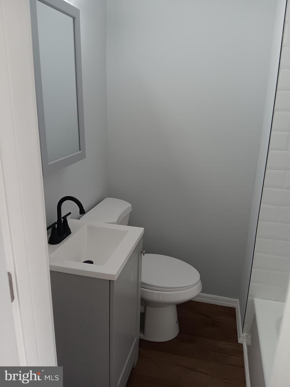 1020 Potter Street Chester, PA 19013 - Photo 10 of 16 a bathroom with a toilet sink and vanity