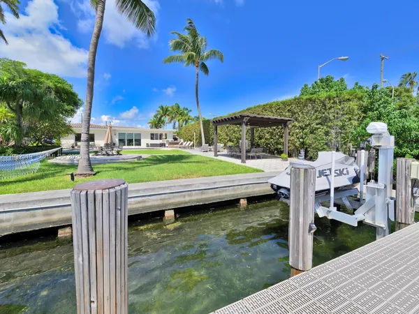 a view of a backyard with sitting area