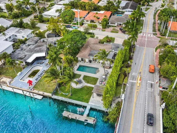 an aerial view of residential house with outdoor space and swimming pool