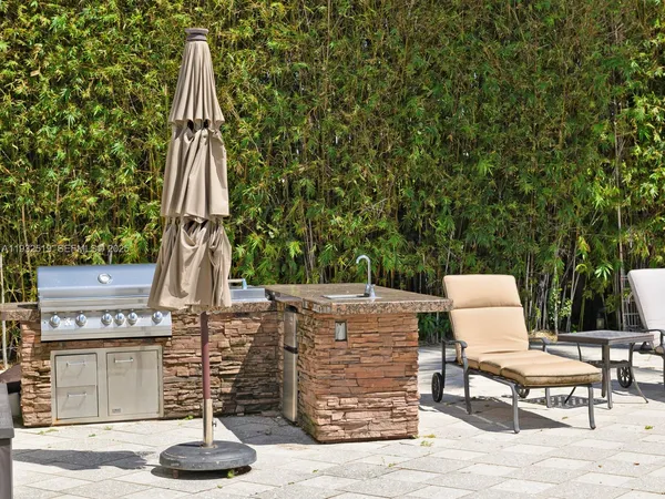 a view of a patio with a table and chairs