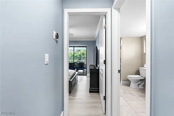 a view of a bathroom from a hallway