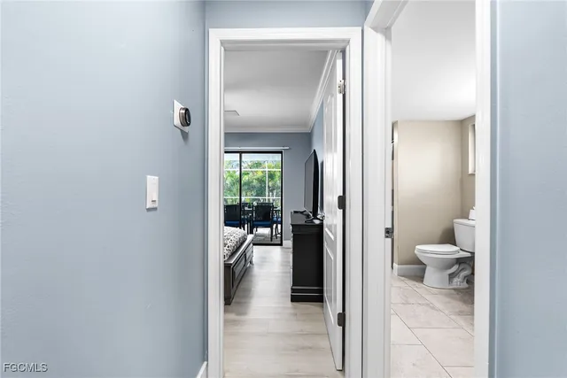 a view of a bathroom from a hallway
