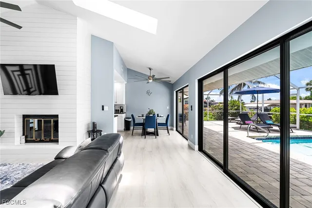 a dining room with furniture and wooden floor