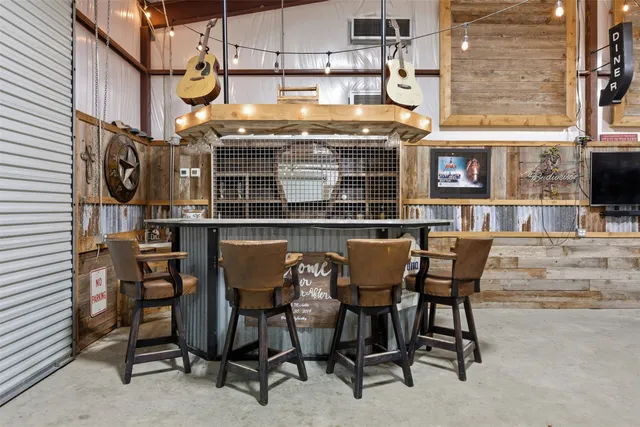 a view of a field with an trees in the background