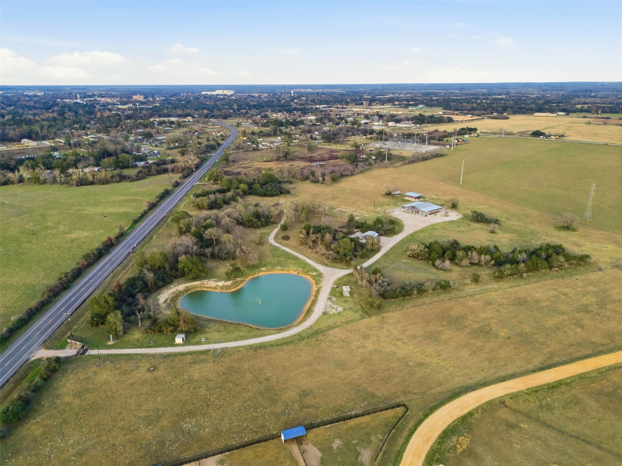 25062 Highway 159 East Hempstead, TX 77445 - Photo 18 of 49 an aerial view of residential houses with outdoor space
