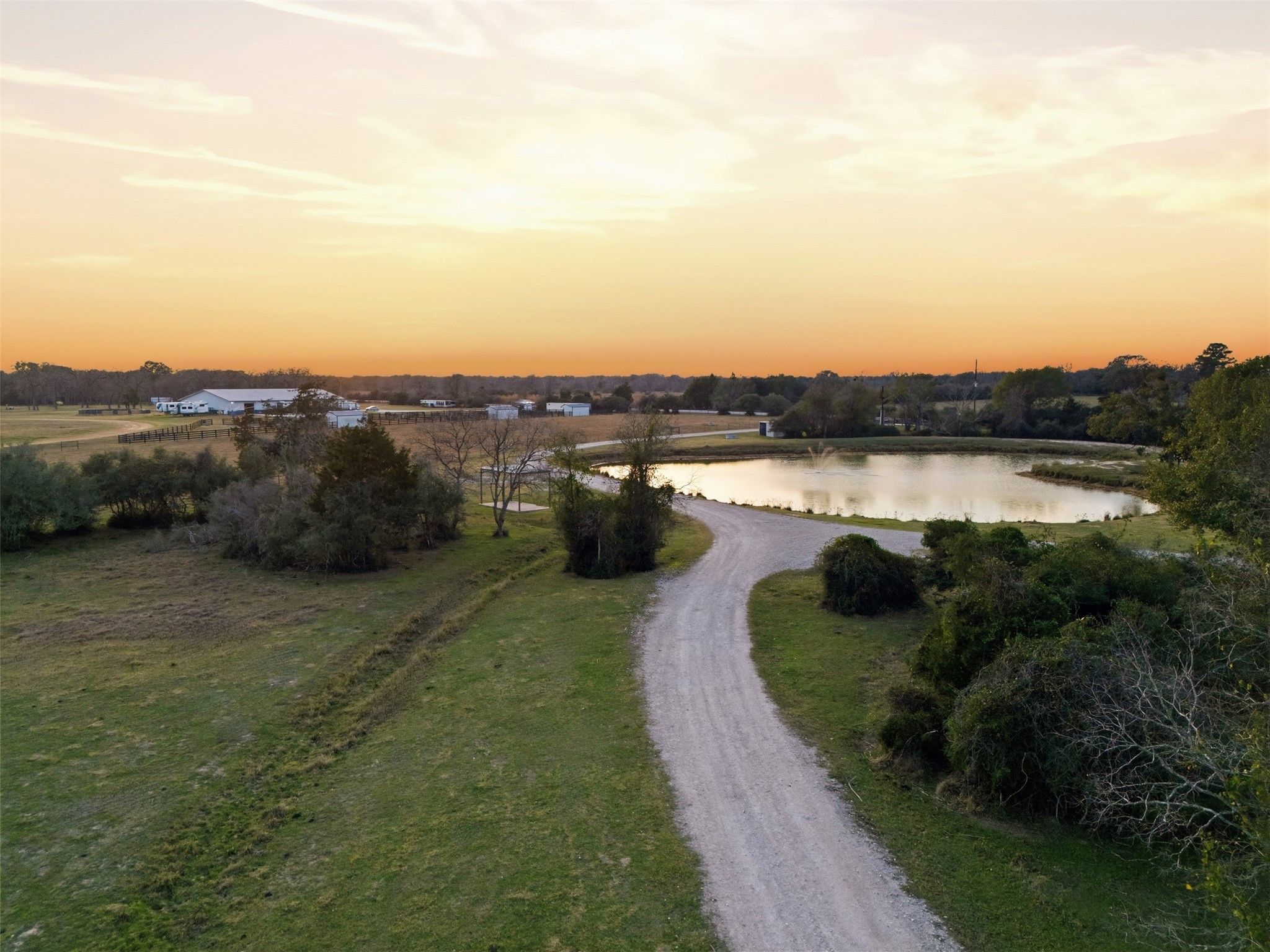 25062 Highway 159 East Hempstead, TX 77445 - Photo 22 of 49 a view of a lake with houses in the back