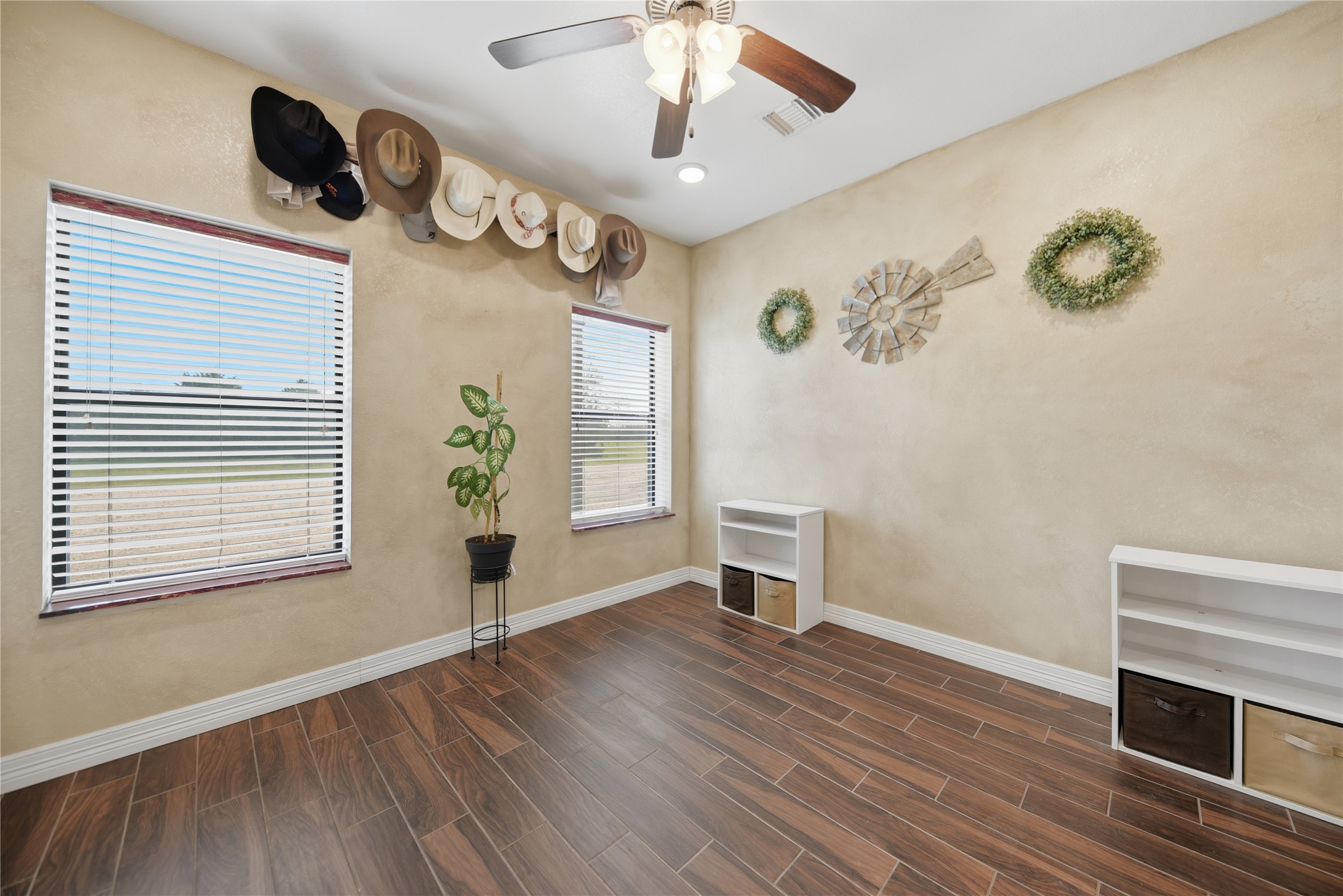 25062 Highway 159 East Hempstead, TX 77445 - Photo 34 of 49 a view of an empty room with a window and wooden floor