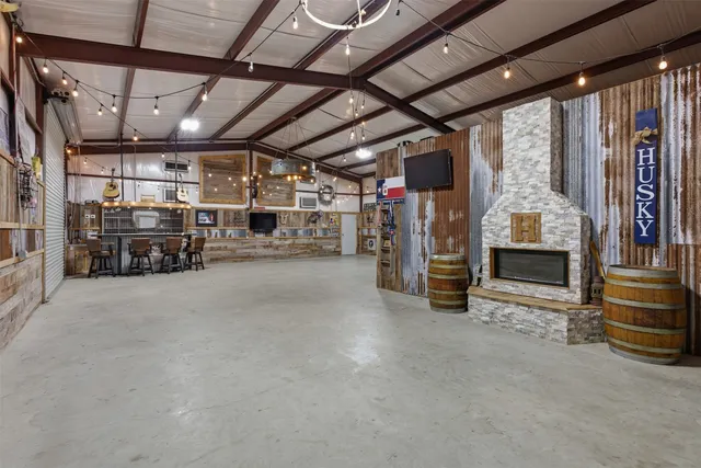 a bathroom with a granite countertop sink mirror vanity and toilet