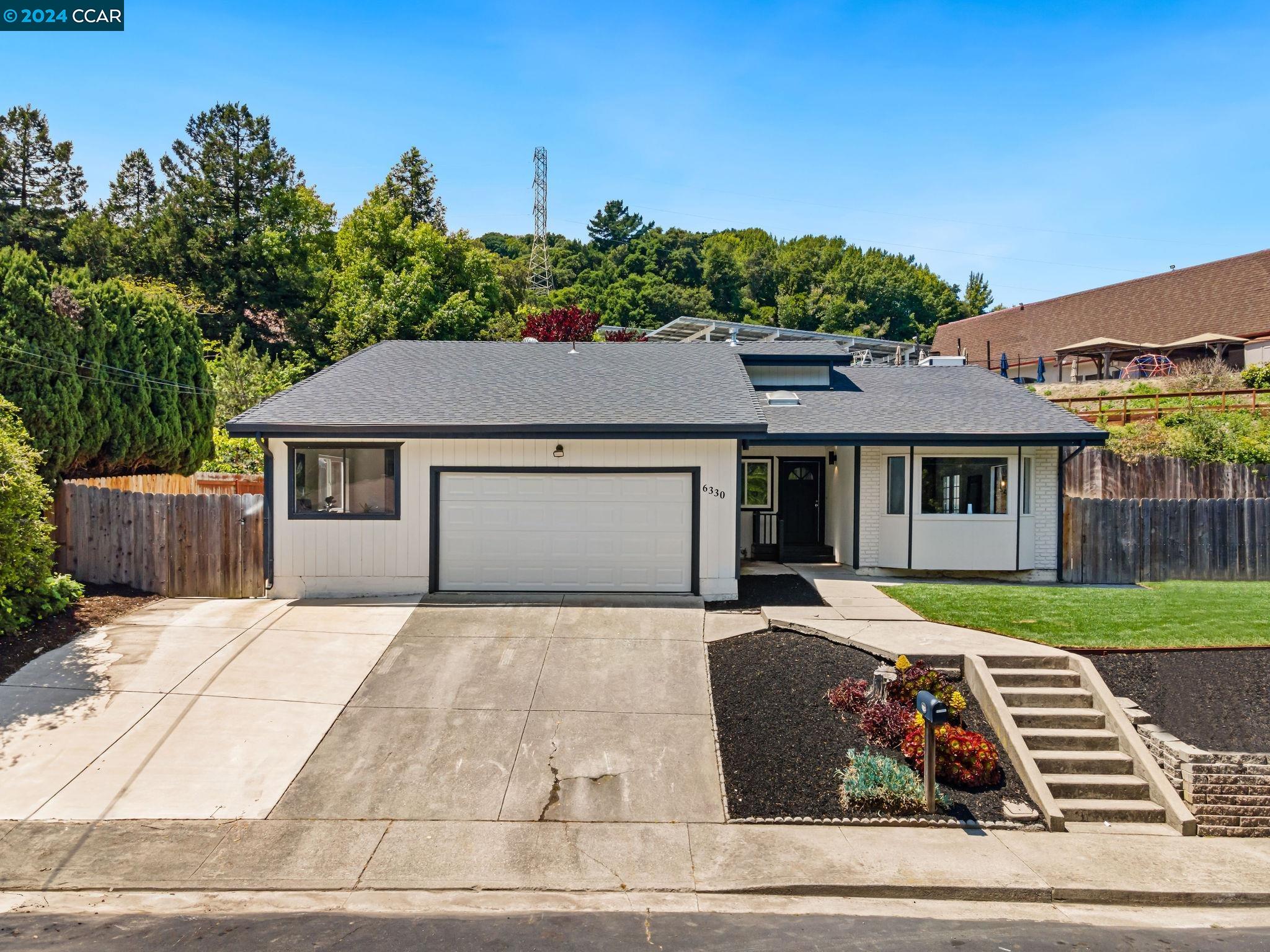 6330 Tri Lane El Sobrante, CA 94803 - Photo 1 of 1 a front view of a house with garden