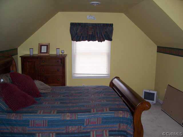 5612 Gatebridge Road Richmond, VA 23234 - Photo 9 of 9 a bed sitting in a bedroom next to a window
