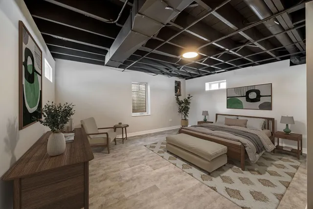 a spacious bedroom with a bed and a table