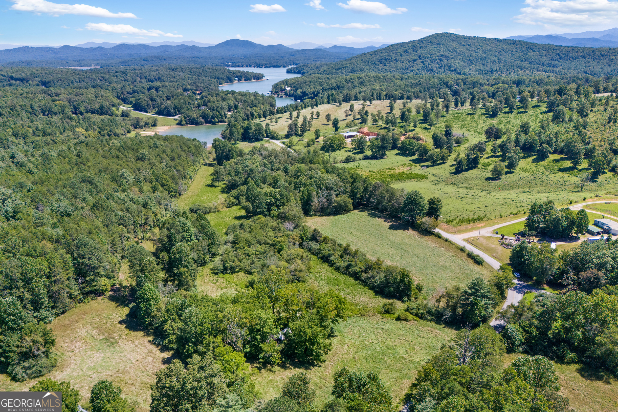 1489 Boy Scout Road Blairsville, GA 30512 - Photo 17 of 43 an aerial view of green landscape with trees houses and mountain view