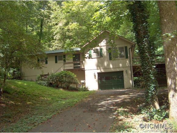 55 Holstein Farm Road Waynesville, NC 28785 - Photo 1 of 24 a front view of a house with a yard