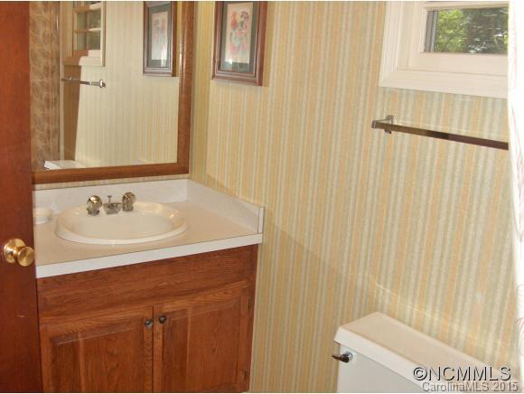 55 Holstein Farm Road Waynesville, NC 28785 - Photo 11 of 24 a bathroom with a sink and a mirror