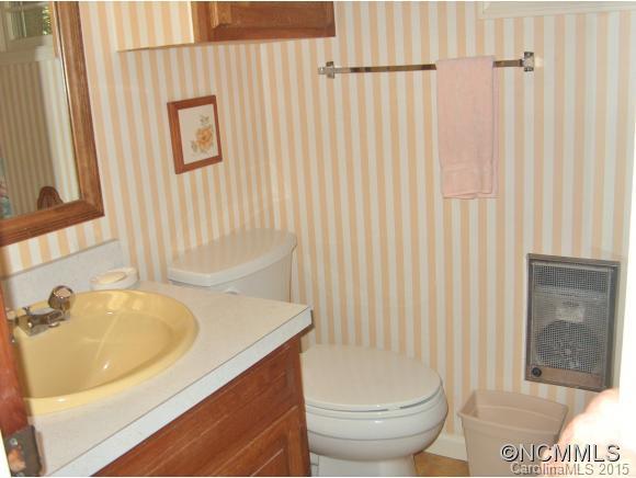 55 Holstein Farm Road Waynesville, NC 28785 - Photo 14 of 24 a bathroom with a sink and a toilet