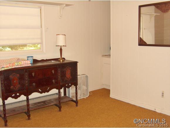 55 Holstein Farm Road Waynesville, NC 28785 - Photo 15 of 24 a living room with furniture and a window