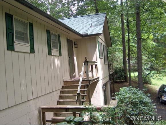 55 Holstein Farm Road Waynesville, NC 28785 - Photo 18 of 24 a view of a house with backyard and trees