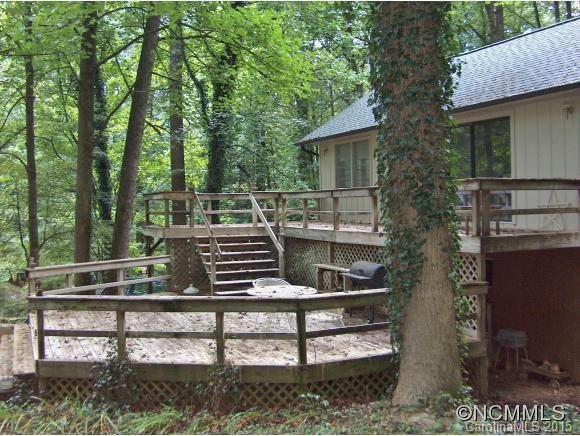 55 Holstein Farm Road Waynesville, NC 28785 - Photo 20 of 24 a view of a wooden deck and a yard
