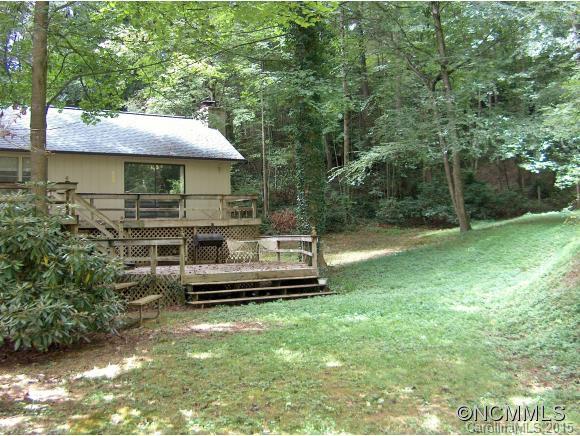55 Holstein Farm Road Waynesville, NC 28785 - Photo 3 of 24 a front view of a house with a garden
