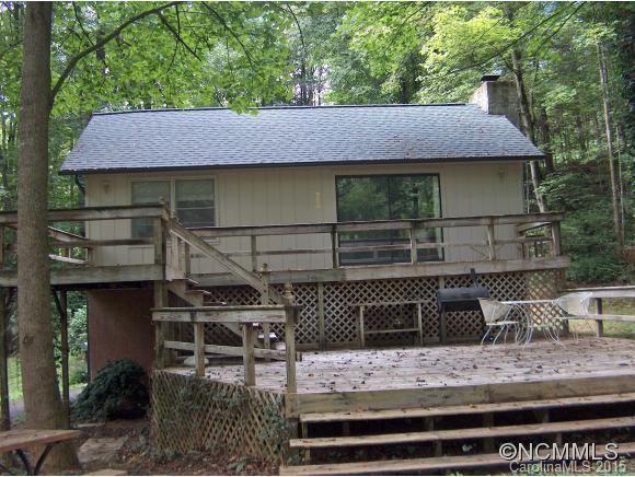 55 Holstein Farm Road Waynesville, NC 28785 - Photo 5 of 24 a view of a wooden house with a yard