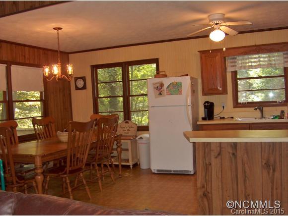 55 Holstein Farm Road Waynesville, NC 28785 - Photo 7 of 24 a dining table with chairs and window