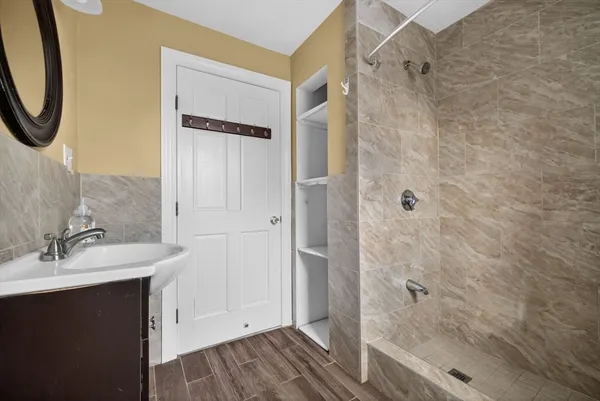a bathroom with a sink and a mirror