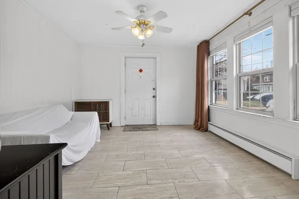 a view of an empty room with a window