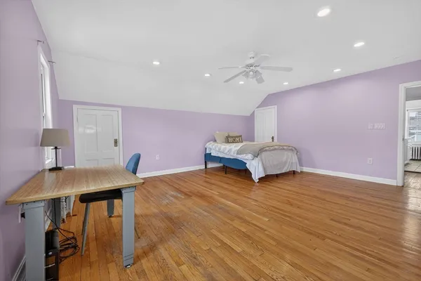 a living room with kitchen island furniture and a wooden floor