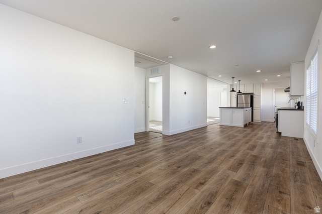 749 Riddle Drive Fredonia, AZ 86022 - Photo 25 of 41 Unfurnished living room featuring dark wood-style flooring and recessed lighting