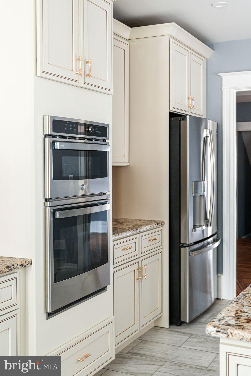 452 South 48th Street Philadelphia, PA 19143 - Photo 21 of 60 a kitchen with cabinets and stainless steel appliances