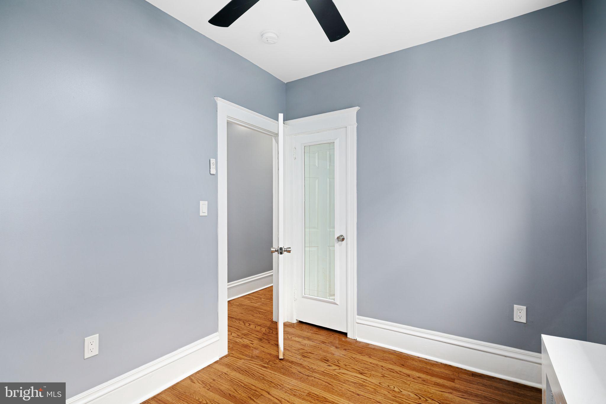 452 South 48th Street Philadelphia, PA 19143 - Photo 26 of 60 a view of an empty room with wooden floor